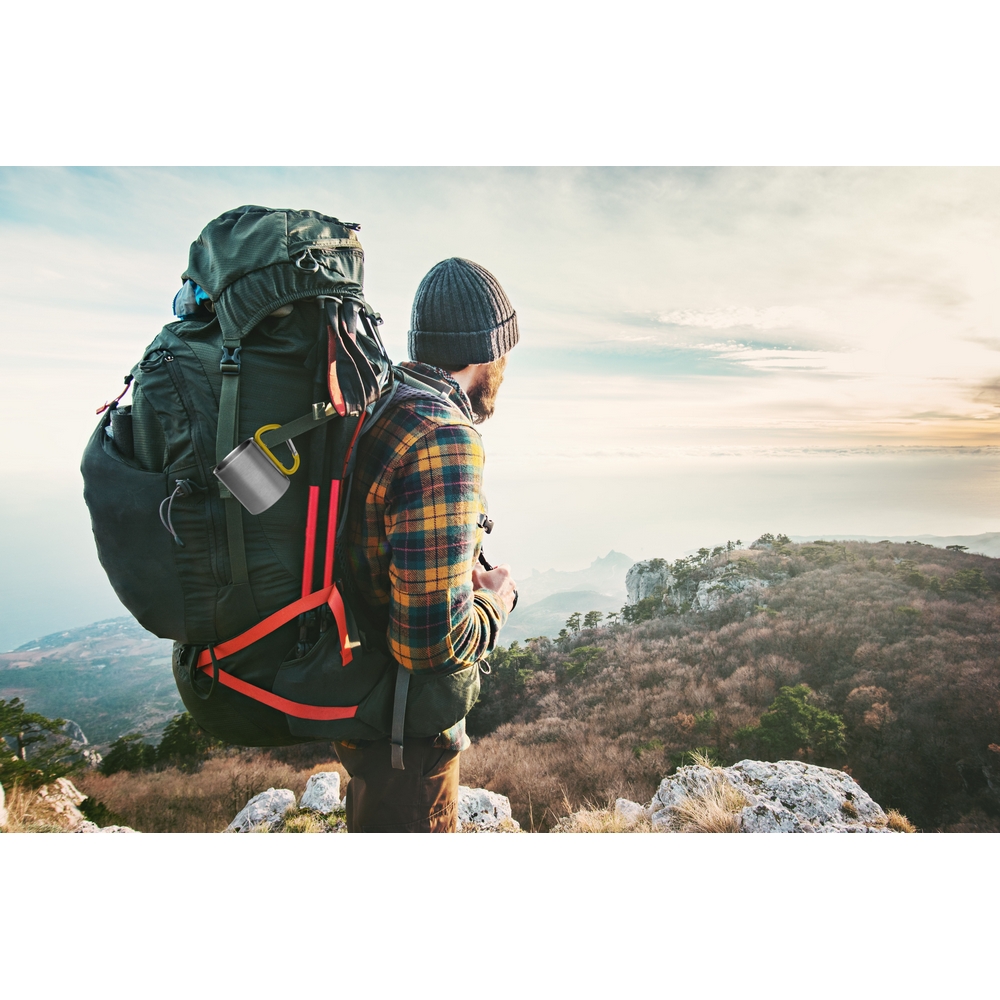Man Traveler with big backpack hiking mountains expedition Trave